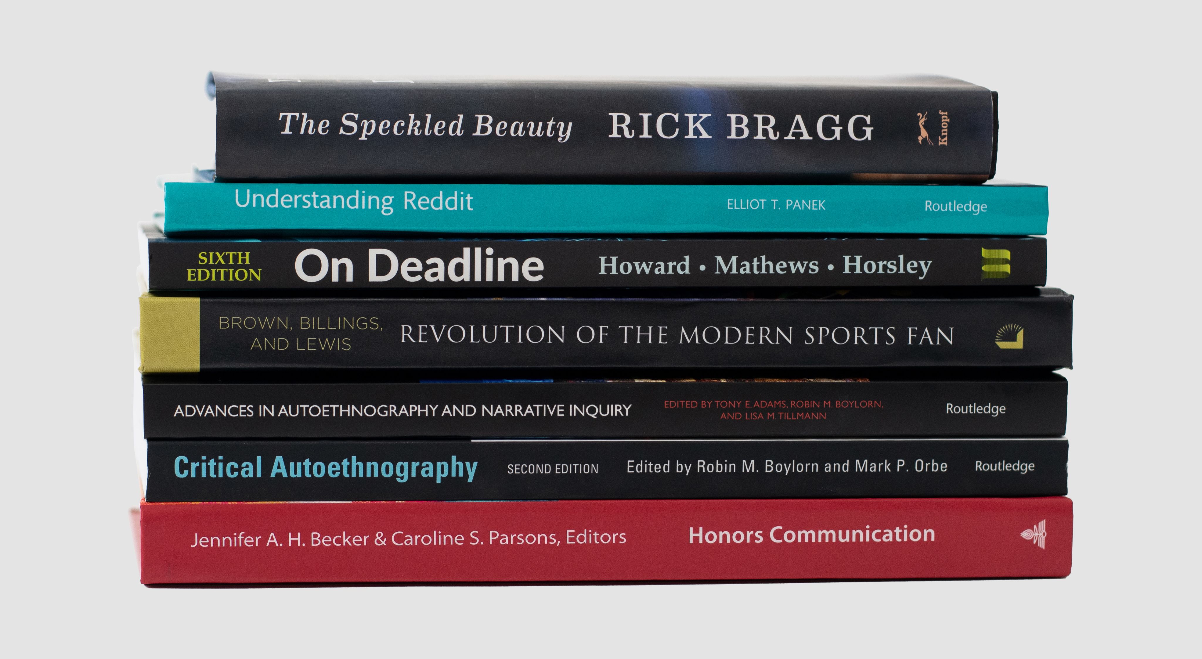 Stack of books produced by C&IS faculty