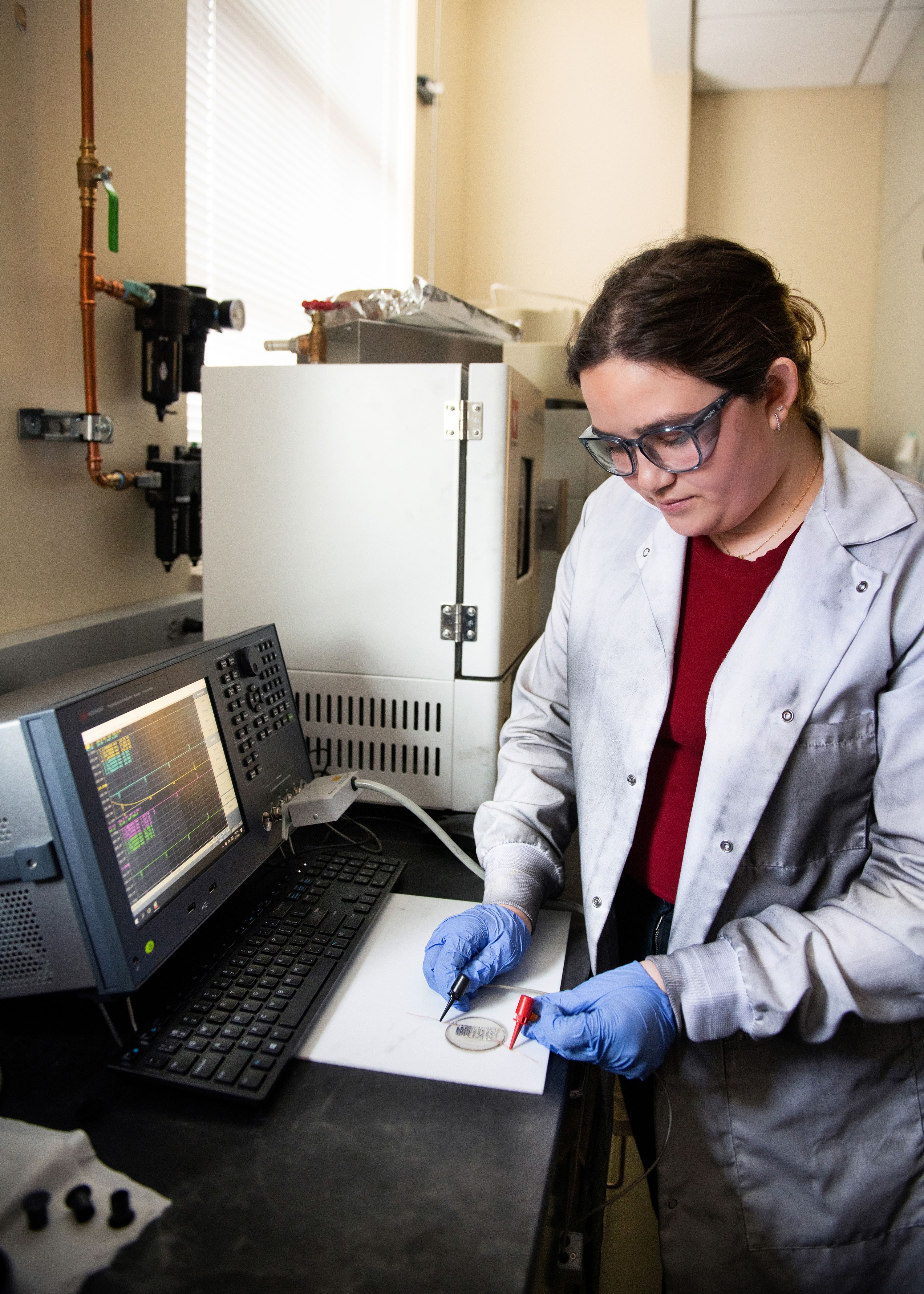 Bury uses a printed electrode in her lab.