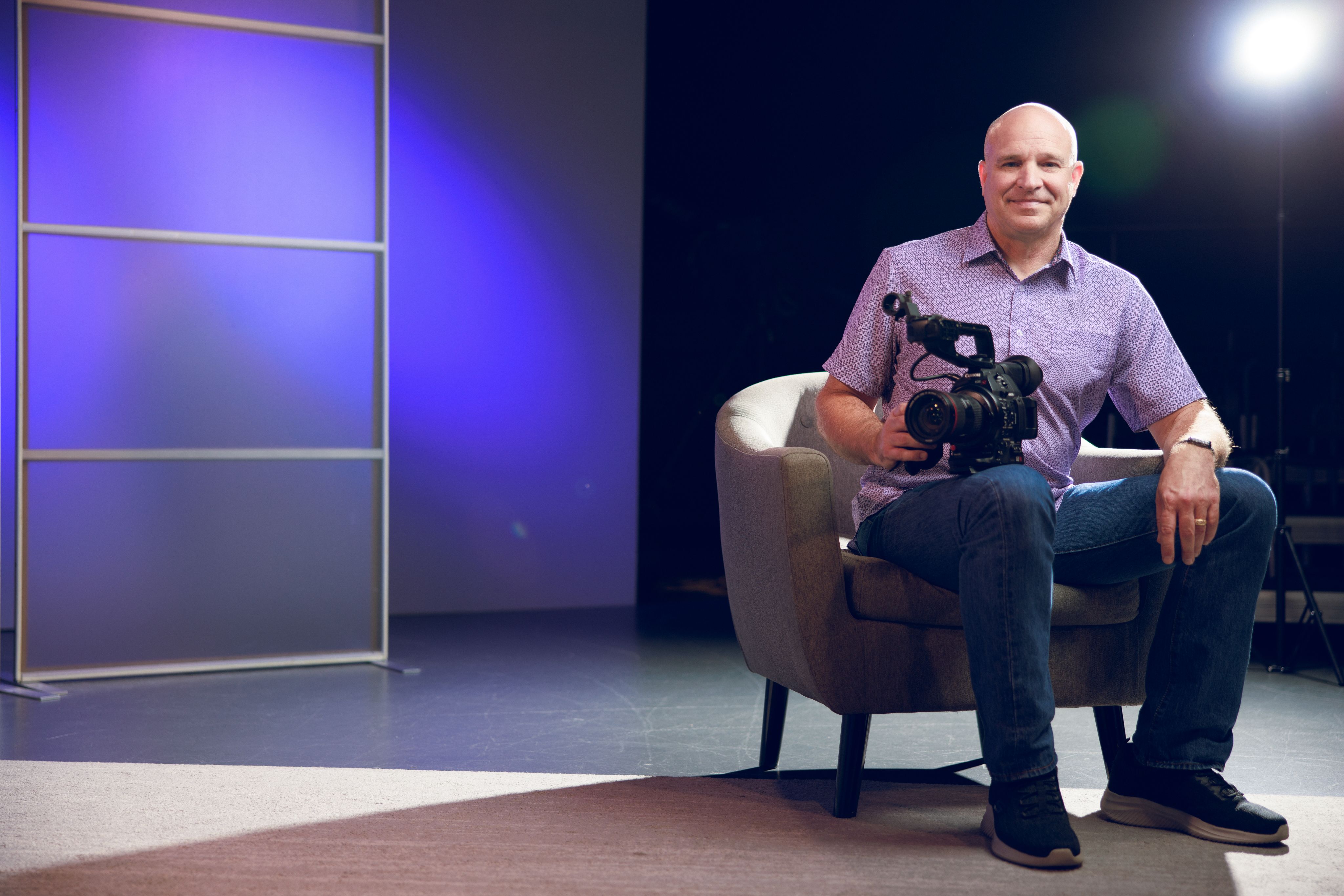 Dr. Michael Bruce poses with video camera