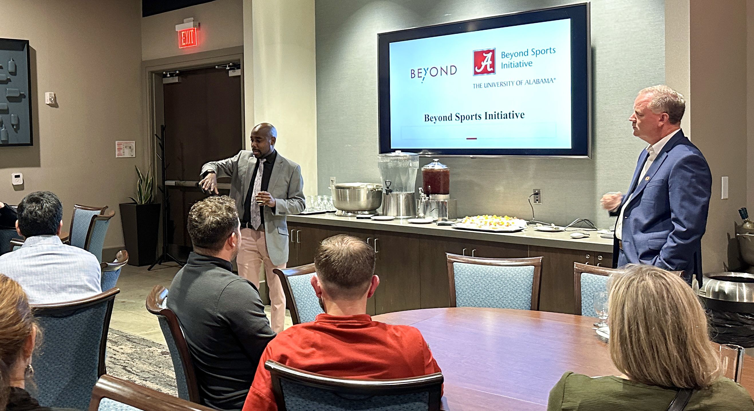 Dr. Kenon Brown toasts the new Beyond Sports Initiative