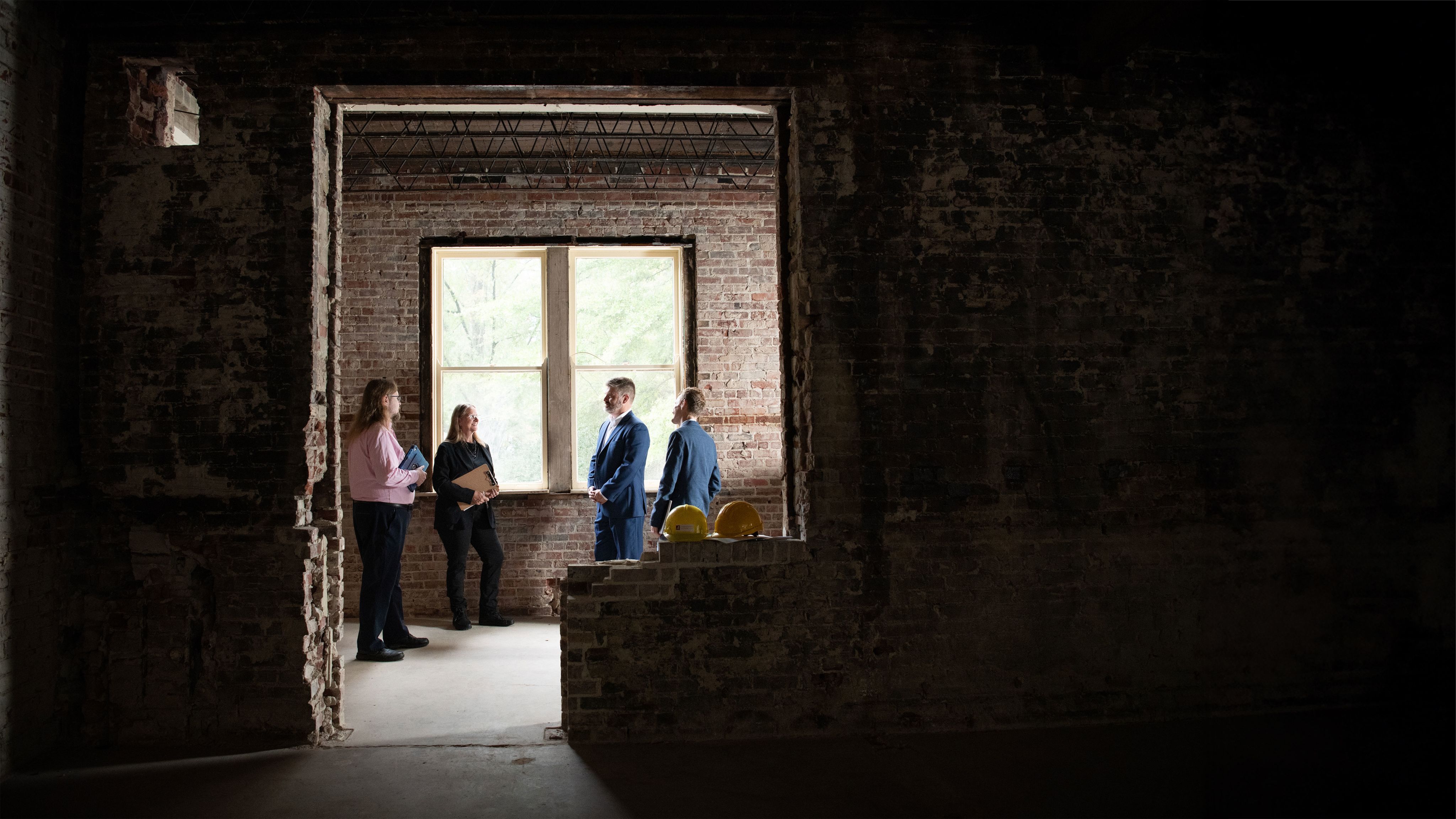 Dr. Steven Yates and Dr. Jamie Naidoo inspect the McLure Building renovations